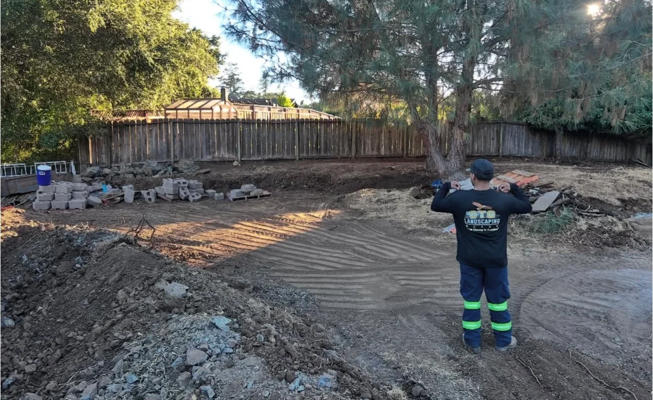 Residential backyard before landscaping — grading and site preparation